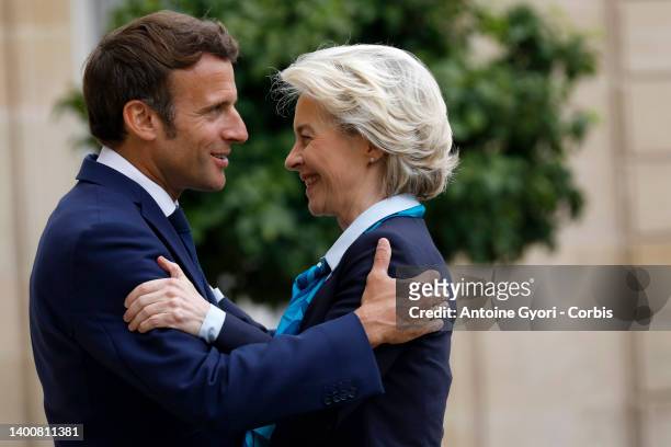 French President Emmanuel Macron welcomes European Commission President Ursula von der Leyen prior to a working lunch at the Elysee Palace on June...