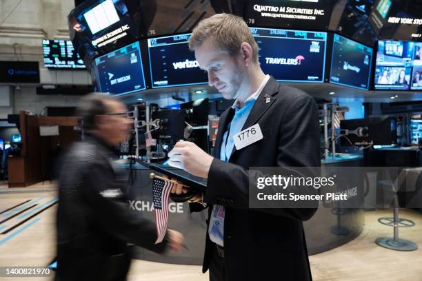 Traders work on the floor of the New York Stock Exchange at the start of the trading day on June 03, 2022 in New York City. A new jobs report...