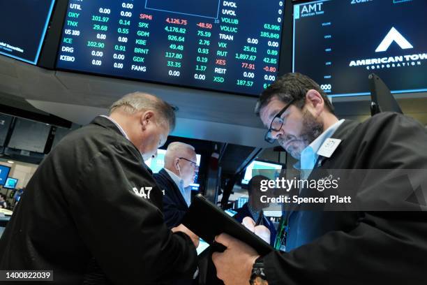 Traders work on the floor of the New York Stock Exchange at the start of the trading day on June 03, 2022 in New York City. A new jobs report...