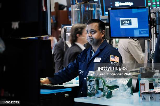 Traders work on the floor of the New York Stock Exchange at the start of the trading day on June 03, 2022 in New York City. A new jobs report...