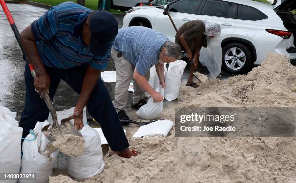 People fill sandbags at Mills Pond Park as they prepare for the expected arrival of Tropical Storm Alex on June 03, 2022 in Fort Lauderdale, Florida....