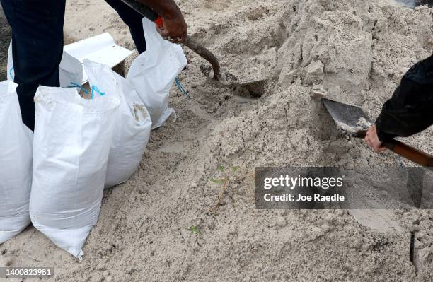 People fill sandbags at Mills Pond Park as they prepare for the expected arrival of Tropical Storm Alex on June 03, 2022 in Fort Lauderdale, Florida....