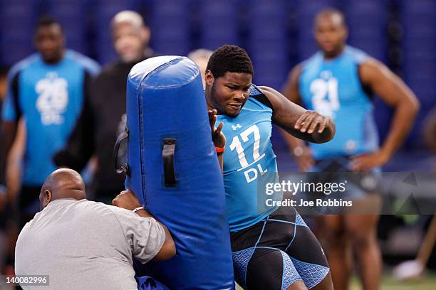 Defensive lineman Justin Francis of Rutgers participates in a drill during the 2012 NFL Combine at Lucas Oil Stadium on February 27, 2012 in...