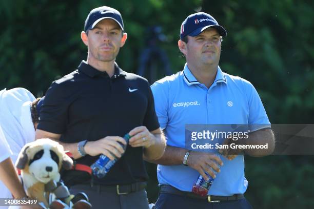 Rory McIlroy of Northern Ireland and Patrick Reed of the United States look on from the 15th tree during the second round of the Memorial Tournament...