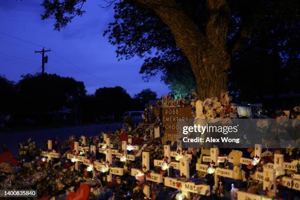Wooden crosses are placed at a memorial dedicated to the victims of the mass shooting at Robb Elementary School on June 3, 2022 in Uvalde, Texas. 19...