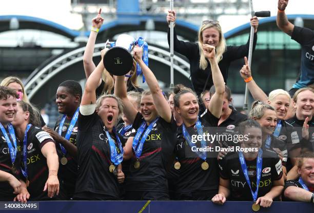 Marlie Packer of Saracens and Lottie Clapp of Saracens lift the trophy after the Allianz Premier 15s Final match between Saracens Women and Exeter...
