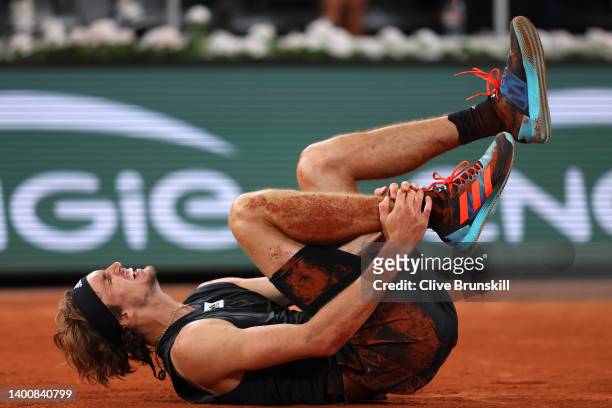 Alexander Zverev of Germany lies injured against Rafael Nadal of Spain during the Men's Singles Semi Final match on Day 13 of The 2022 French Open at...