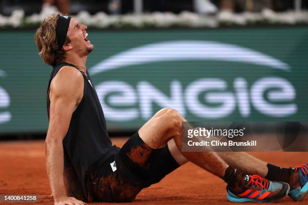 Alexander Zverev of Germany lies injured against Rafael Nadal of Spain during the Men's Singles Semi Final match on Day 13 of The 2022 French Open at...