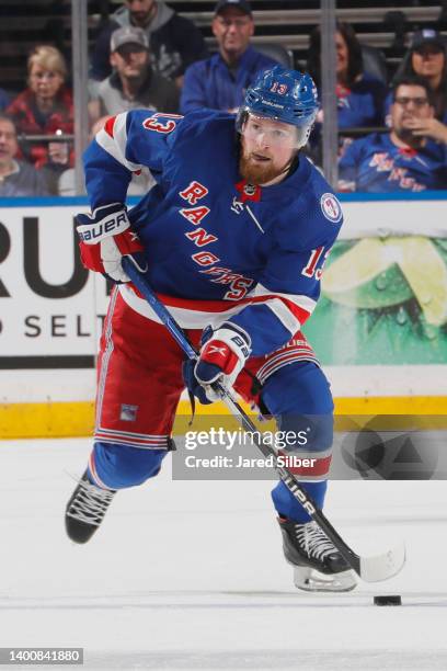 Alexis Lafreniere of the New York Rangers skates with the puck against the Tampa Bay Lightning in Game One of the Eastern Conference Final of the...