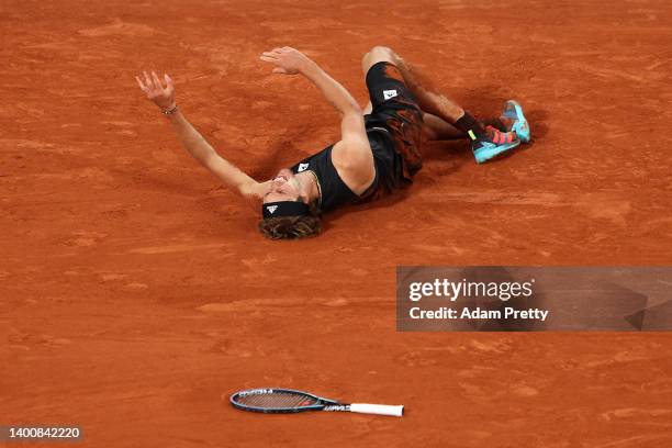 Alexander Zverev of Germany lies injured against Rafael Nadal of Spain during the Men's Singles Semi Final match on Day 13 of The 2022 French Open at...