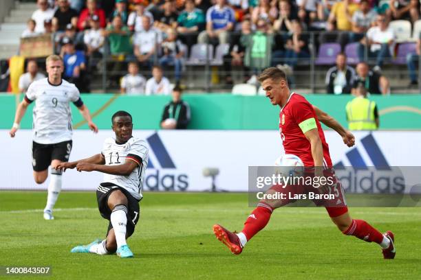 Youssoufa Moukoko of Germany U21 scores their team's first goal past Attila Mocsi of Hungary U21 during the UEFA European Under-21 Championship...