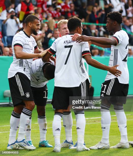Youssoufa Moukoko of Germany U21 celebrates their team's first goal with teammates during the UEFA European Under-21 Championship Qualifier Group B...