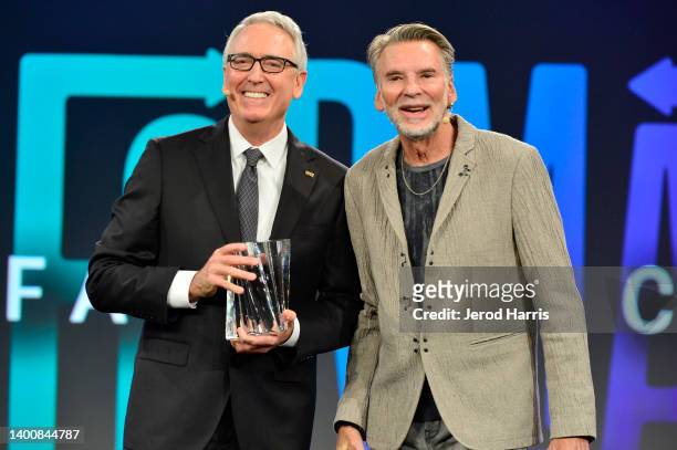 President & CEO Joe Lamond and Kenny Loggins speak onstage during the 2022 NAMM Show Opening Day at Anaheim Convention Center on June 03, 2022 in...