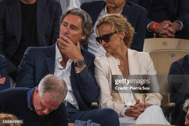 Caroline Roux and Laurent Solly are seen at Roland Garros on June 03, 2022 in Paris, France.
