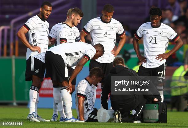 Angelo Stiller of Germany U21 receives treatment during the UEFA European Under-21 Championship Qualifier Group B match between Germany U21 and...