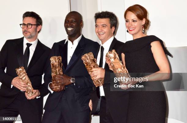 Michel Hazanavicius, Omar Sy, Thomas Langmann and Berenice Bejo pose after receiving Cesar Awards during the 37th Cesar Film Awards at Theatre du...