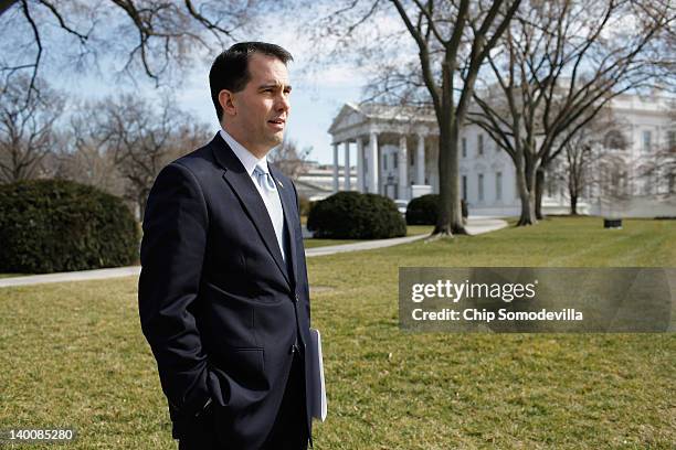 Wisconsin Gov. Scott Walker stands on the North Lawn of the White House before making remarks to the news media after a meeting of the National...