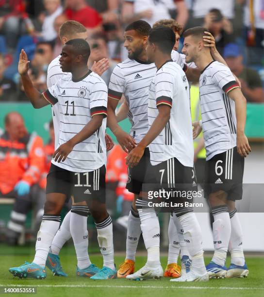 Tom Krauss of Germany U21 celebrates their team's third goal with teammates during the UEFA European Under-21 Championship Qualifier Group B match...