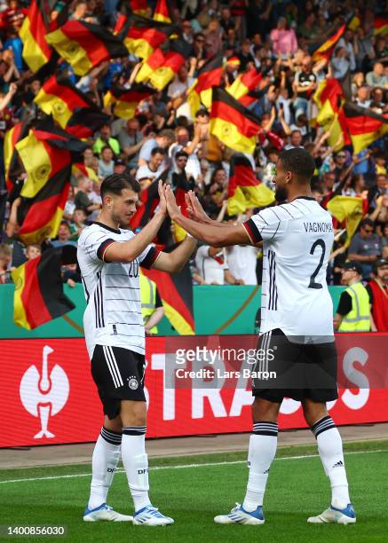 Lazar Samardzic of Germany U21 celebrates their team's fourth goal with teammate Josha Vagnoman during the UEFA European Under-21 Championship...