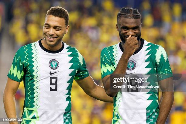 Cyriel Dessers and Terem Moffi of Nigeria laugh before a game against Ecuador at Red Bull Arena on June 02, 2022 in Harrison, New Jersey.