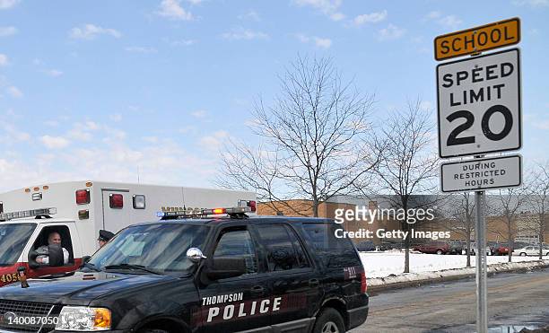 Police car and ambulance sit on the road in front of Chardon High School where a shooting took place on February 27, 2012 in Chardon, Ohio. A gunman,...