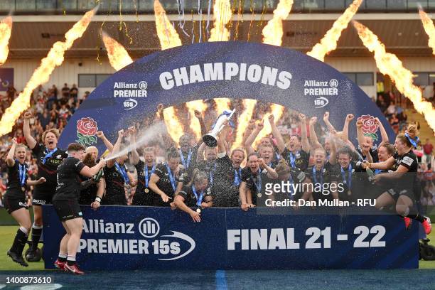 Marlie Packer and Lottie Clapp of Saracens lift the trophy as the players celebrate victory during the Allianz Premier 15s Final between Saracens...