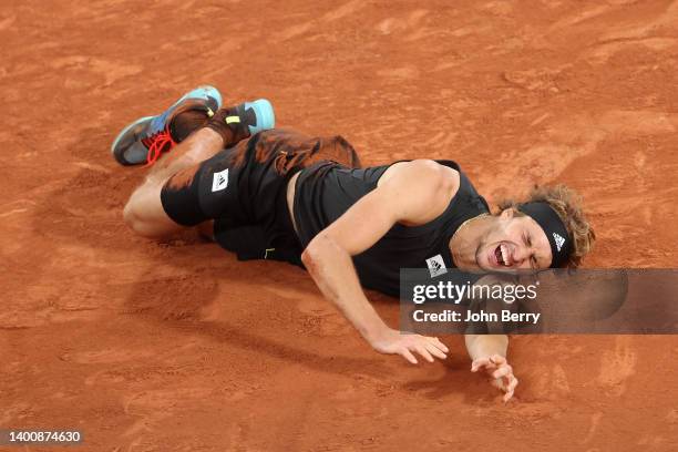 Alexander Zverev of Germany falls following an injury against Rafael Nadal of Spain during the Men's Singles Semi Final match on Day 13 of The 2022...