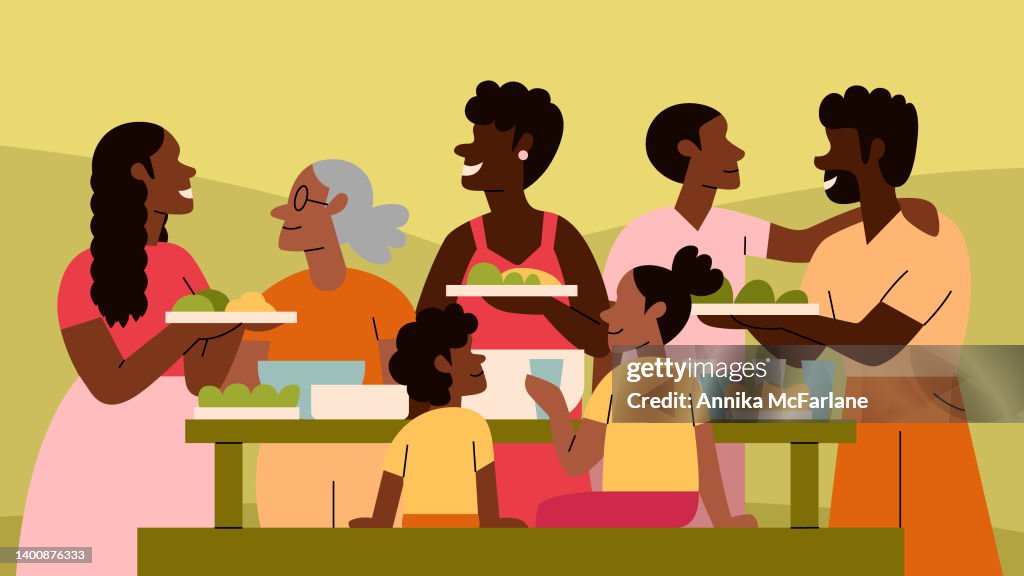 A Black Multigenerational Family and Friends Enjoy a Picnic Together Outside