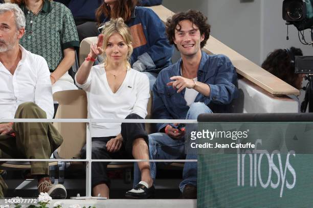 Sienna Miller and Oli Green attend the French Open 2022 at Roland Garros on June 03, 2022 in Paris, France.