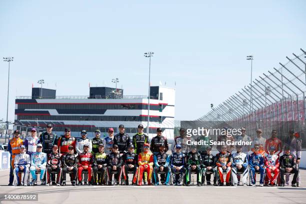 The full field of the NASCAR Cup Series drivers pose for a group photo prior to practice for the NASCAR Cup Series Enjoy Illinois 300 at WWT Raceway...