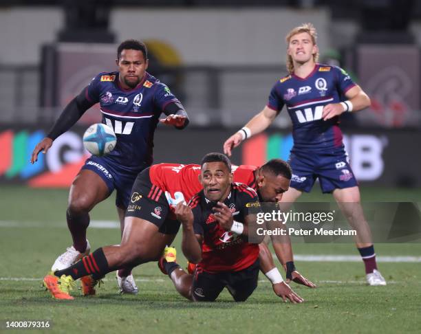 Sevu Reece from the Crusaders offloads during the Super Rugby Pacific Quarter Final match between the Crusaders and the Queensland Reds at...