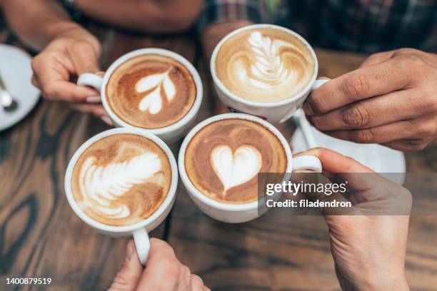 tasty cups of coffee - cafe latte stockfoto's en -beelden