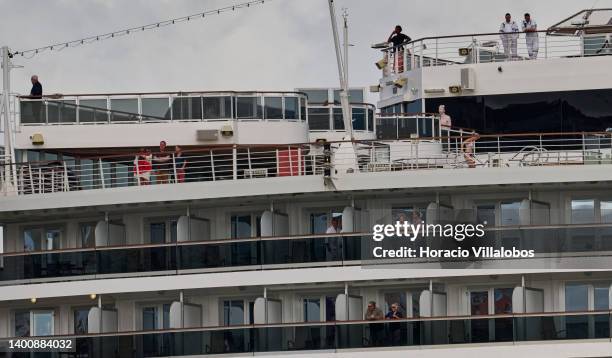Passengers stand on decks as MS Nieuw Statendam, a 99,902 GT Pinnacle-class cruise ship operated by Holland America Line , a division of Carnival...