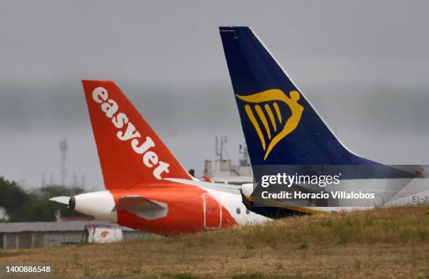 EasyJet and Ryanair aircraft sit on the tarmac in Humberto Delgado International Airport on June 03, 2022 in Lisbon, Portugal. The city's airport has...