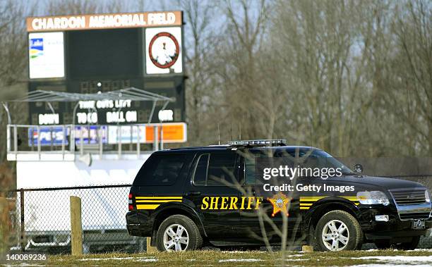 Sheriff deputy's vehicle is parked in front of the scoreboard to the football field at Chardon High School where a shooting took place on February...