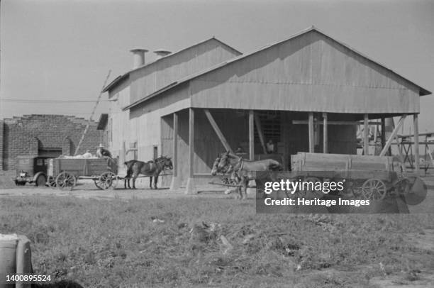 Cotton gin, Hale County, Alabama. Artist Walker Evans.