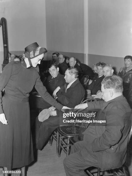 Meeting opens with taking the collection. Army contributes again, as well as the audience. Salvation Army, San Francisco, California. Artist Dorothea...