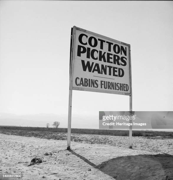 Kern County, California. Sign on U.S. 99 main highway between Los Angeles and San Francisco. ['Cotton Pickers Wanted - Cabins Furnished']. Artist...