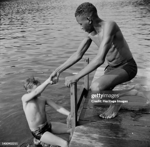 Southfields, New York. Interracial activities at Camp Nathan Hale, where children are aided by the Methodist Camp Service. A scene at the swimming...