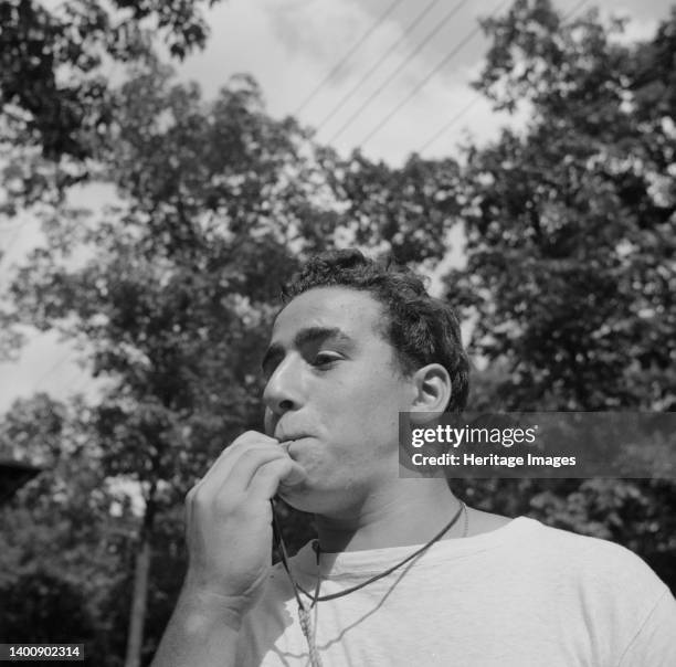 Southfields, New York. Interracial activities at Camp Nathan Hale, where children are aided by the Methodist Camp Service. The town crier, Danny...