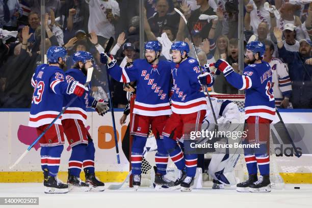 Kaapo Kakko of the New York Rangers celebrates with teammates after scoring a first period goal against the Tampa Bay Lightning in Game Two of the...