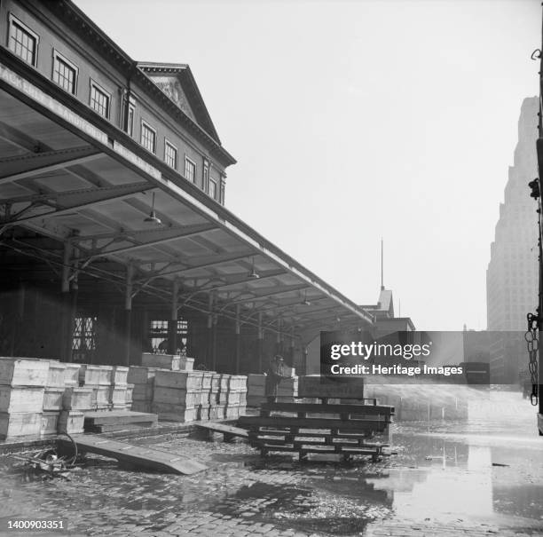 New York, New York. Late evening scene at the Fulton fish market. Artist Gordon Parks.