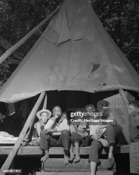 Southfields, New York. Interracial activities at camp Nathan Hale, where children are aided by the Methodist Camp Service. Tent mates. Artist Gordon...