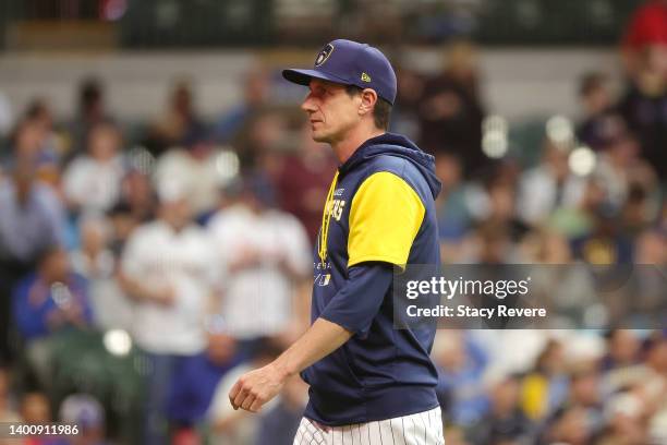 Manager Craig Counsell of the Milwaukee Brewers walks to the dugout during the fourth inning against the San Diego Padres at American Family Field on...