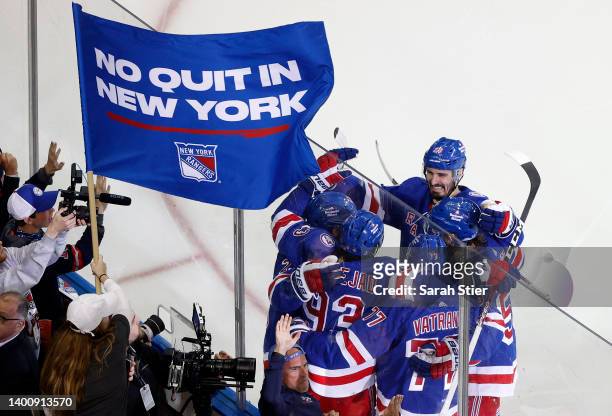 Mika Zibanejad of the New York Rangers celebrates with teammates after scoring a third period goal against the Tampa Bay Lightning in Game Two of the...