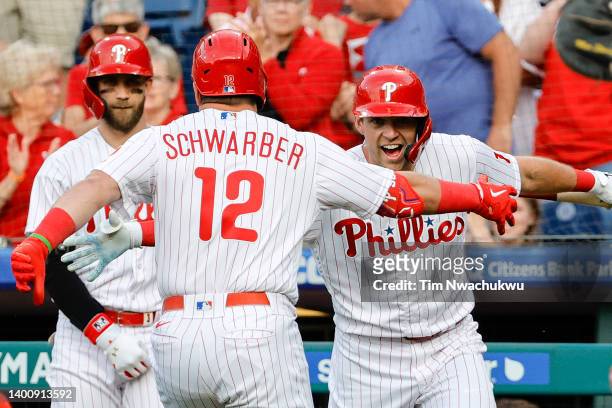 Rhys Hoskins of the Philadelphia Phillies celebrates following a home run by Kyle Schwarber during the first inning against the Los Angeles Angels at...