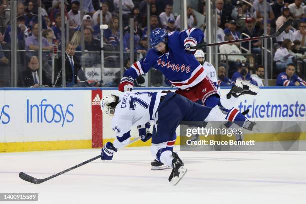 Anthony Cirelli of the Tampa Bay Lightning collides with Jacob Trouba of the New York Rangers during the third period in Game Two of the Eastern...