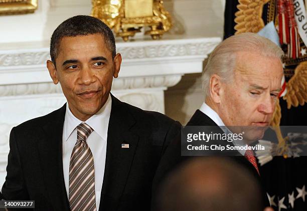 President Barack Obama is introduced by Vice President Joe Biden before addressing a meeting of the National Governors Association at the White House...