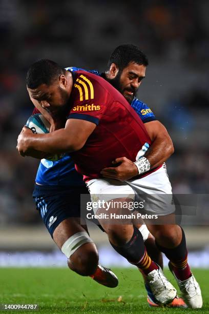 Akira Ioane of the Blues tackles Andrew Makalio of the Highlanders during the Super Rugby Pacific Quarter Final match between the Blues and the...