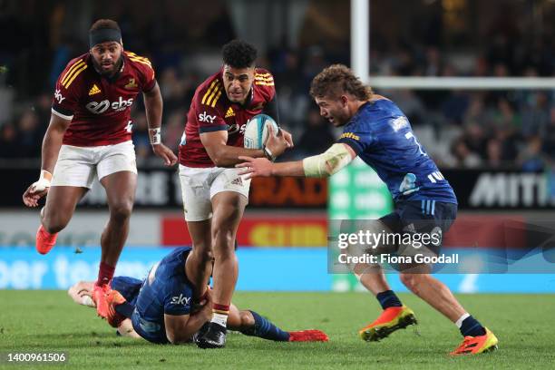 Fetuli Paea of the Highlanders looks for a gap during the quarter final Super Rugby Pacific match between the Blues and the Highlanders at Eden Park...